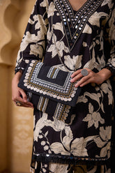 Silver beaded clutch bag showcasing a silver fabric clutch bag styled as an evening clutch bag for vacation looks.