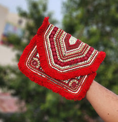 Red beaded fabric clutch bag showcasing a red boho clutch for women styled as a premium red ethnic evening purse.