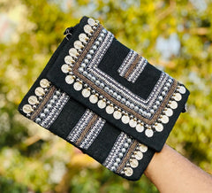 Silver beaded clutch bag showcasing a silver fabric clutch bag styled as an evening clutch bag for vacation looks.